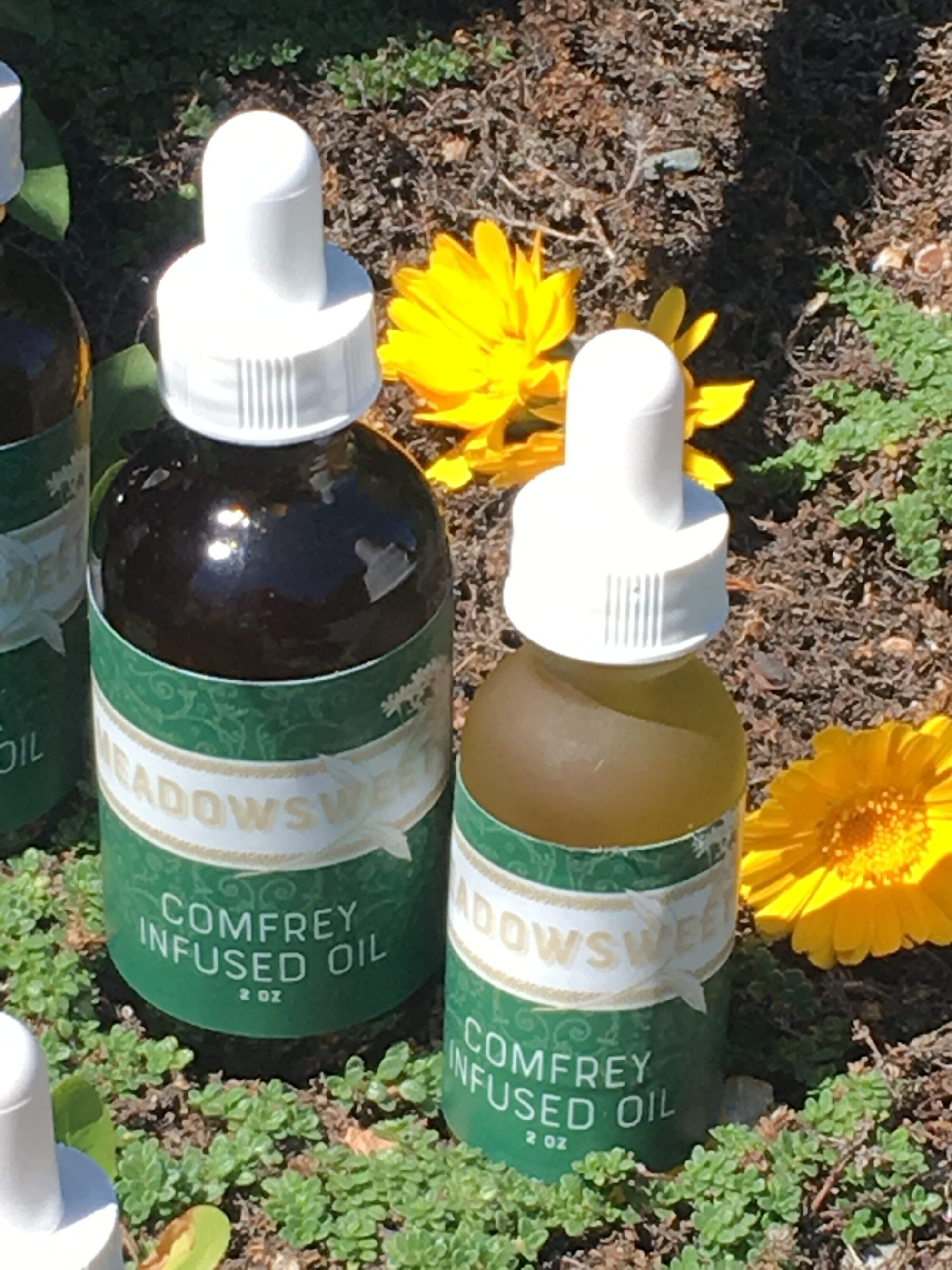 Three bottles of Comfrey Infused Oil