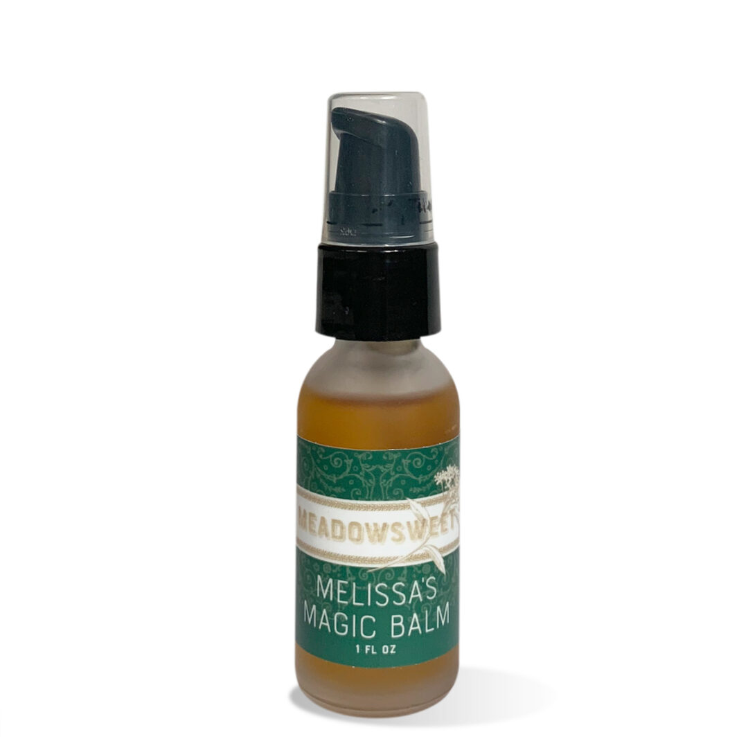 Small frosted glass bottle with black lid containing Melissa's Magic Balm.