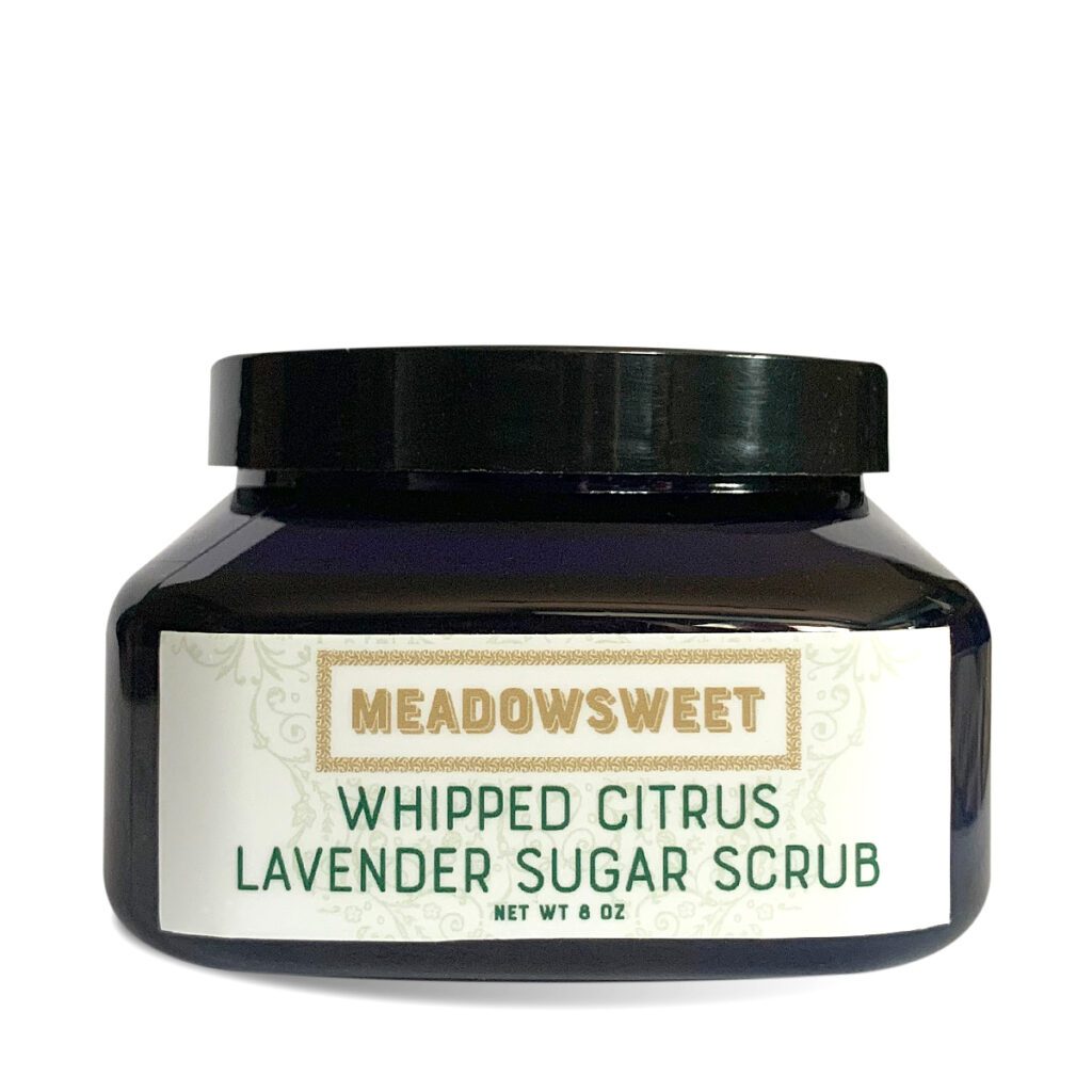 A closed blue plastic tub of Whipped Citrus/Lavender Sugar Scrub