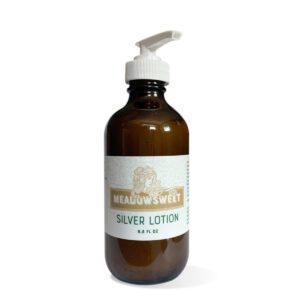 A large brown bottle with a white lotion pump contains Soothing Silver Lotion