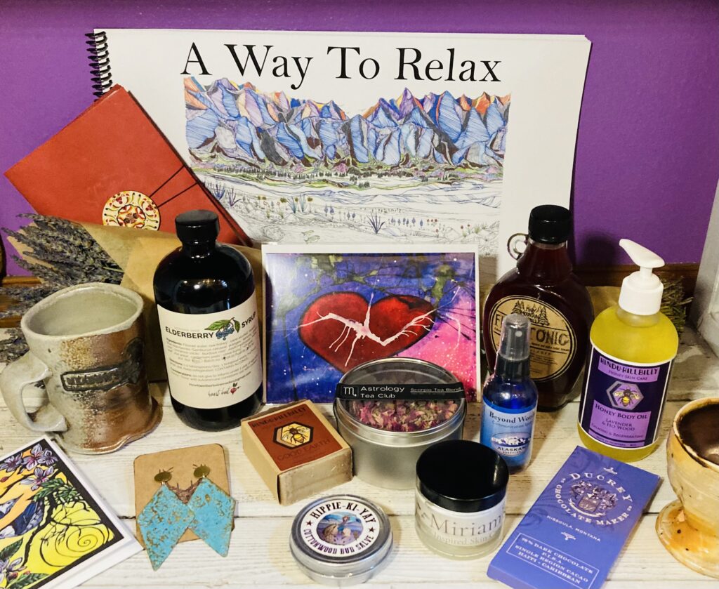 An assortment of local products, including cards, body care, syrups, pottery, chocolate, teas and salves are arranged together